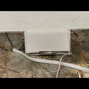 Kate Spade crossbody wallet with detachable top flap closure